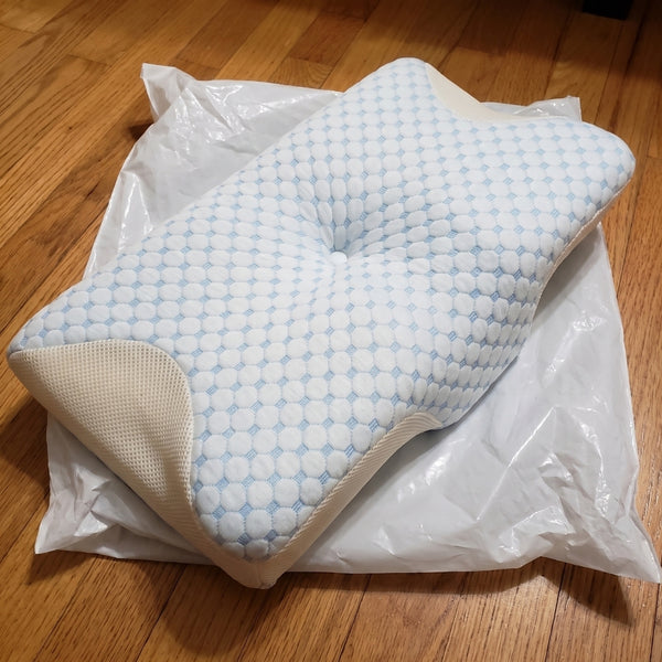 The Serenium Relief Pillow just unpacked, still on its wrapping